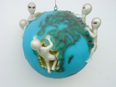 Aliens Climbing on Globe