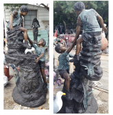 Bronze Children Climbing Rock
