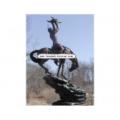 Bronze Indian holding Buffalo Skull