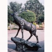 Bronze Elk standing on a Rock