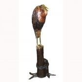 Bronze Crane On Tree