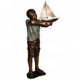 Bronze Kid with the boat
