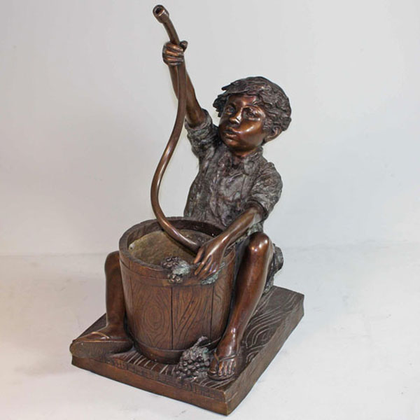 Bronze sitting Boy with Hose and Bucket Fountain