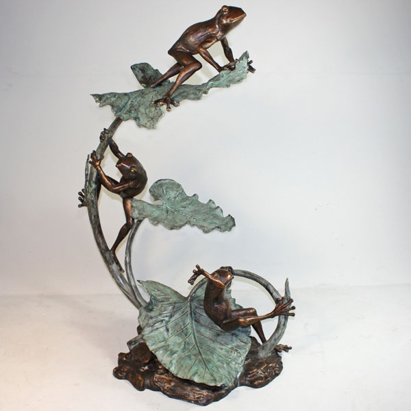 Bronze Frogs climbing on a Lily Pad Fountain
